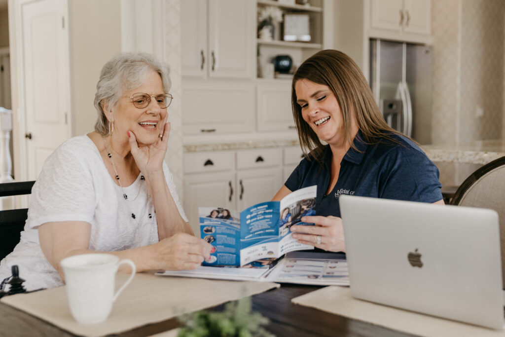 care manager explaining total care connections services to elderly woman