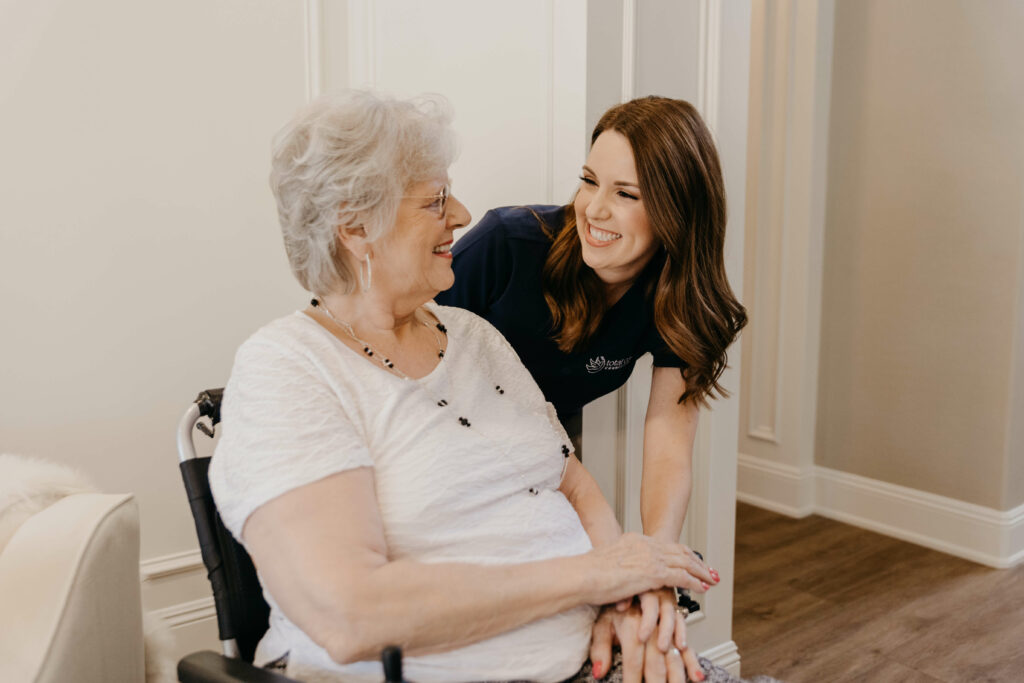 Nurse smiling with elderly woman