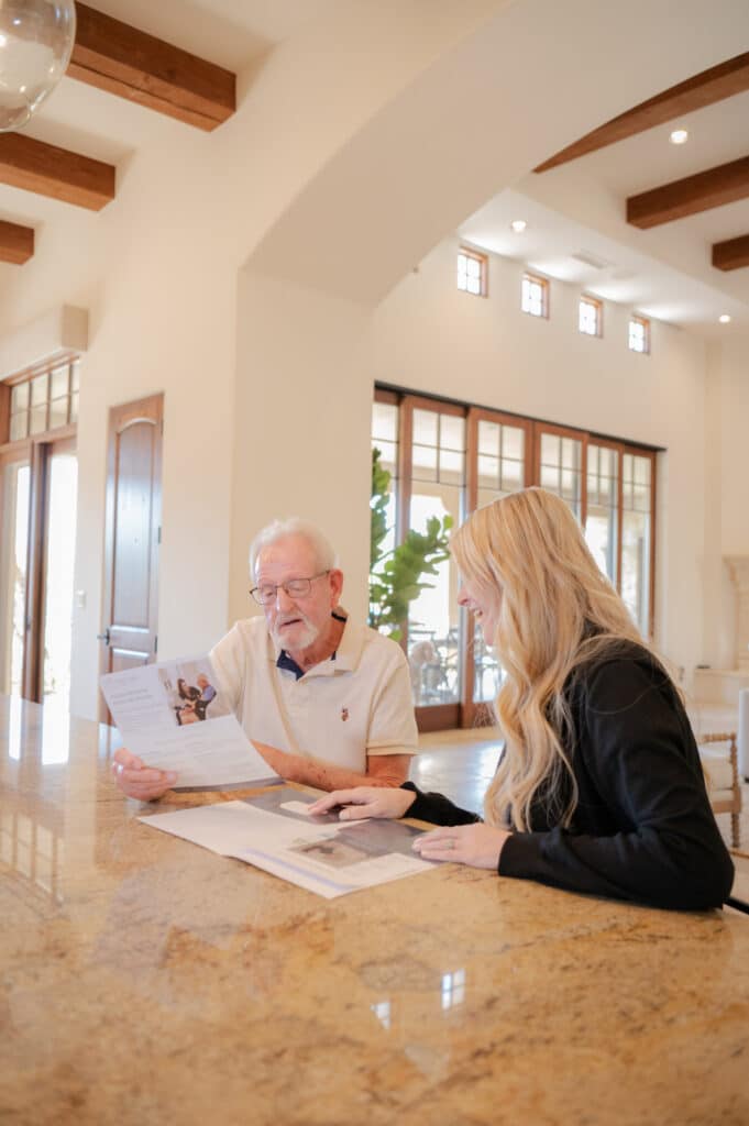 Office staff explaining the care plan carefully to the client.